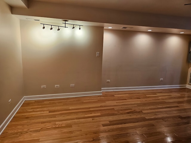 empty room featuring wood-type flooring