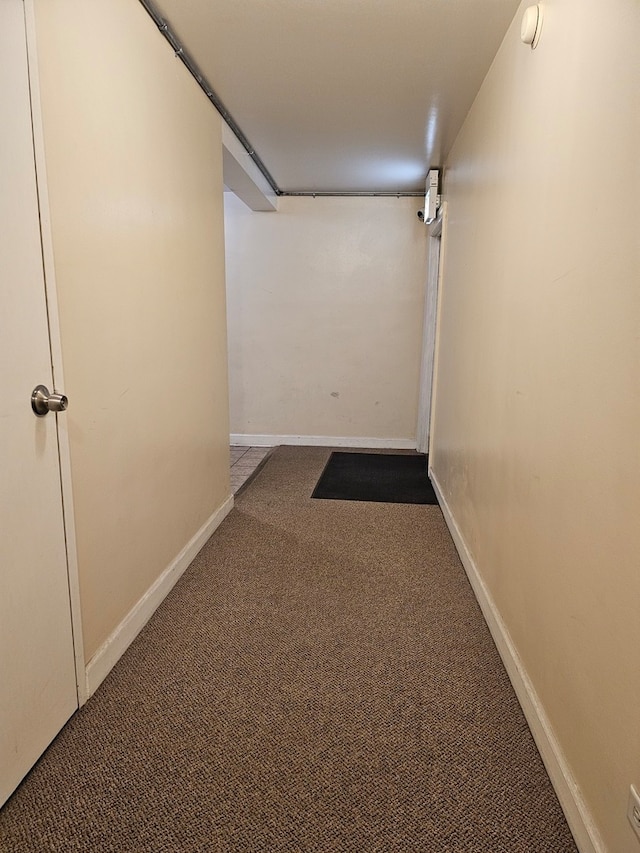 hall featuring carpet flooring