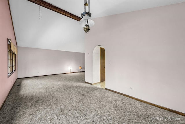 spare room with high vaulted ceiling and light colored carpet