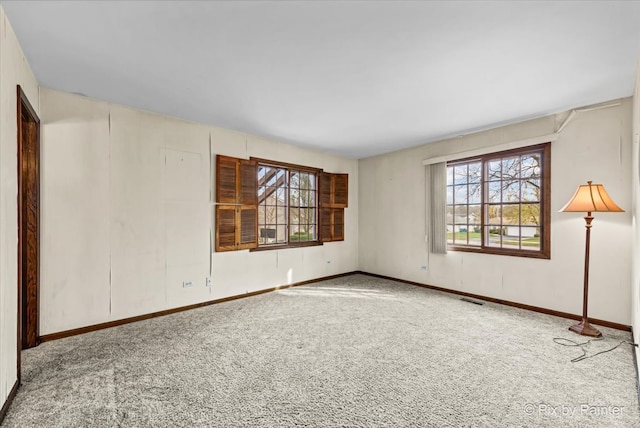 empty room featuring carpet flooring