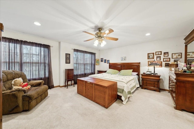 bedroom with light colored carpet and ceiling fan