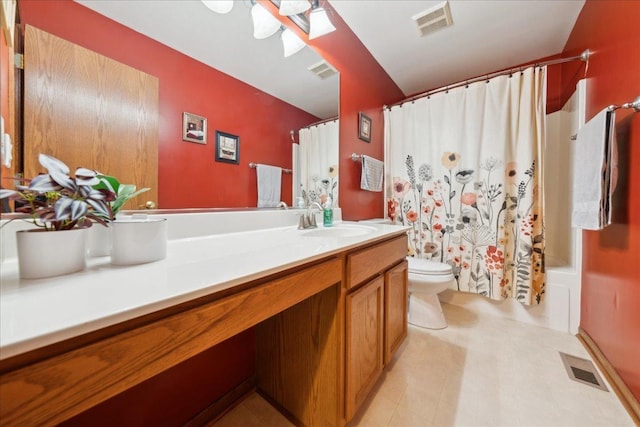 full bathroom featuring vanity, toilet, and shower / tub combo