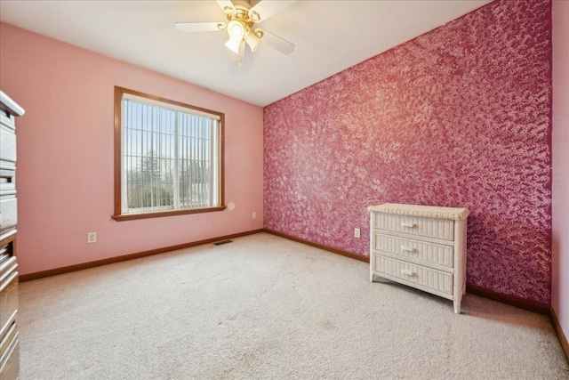 unfurnished bedroom with carpet flooring and ceiling fan