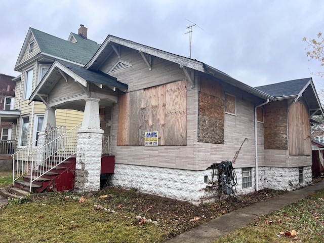 view of home's exterior with covered porch