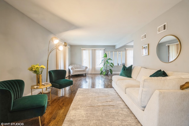 living room with dark hardwood / wood-style flooring