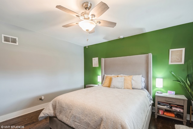 bedroom featuring ceiling fan and dark hardwood / wood-style floors