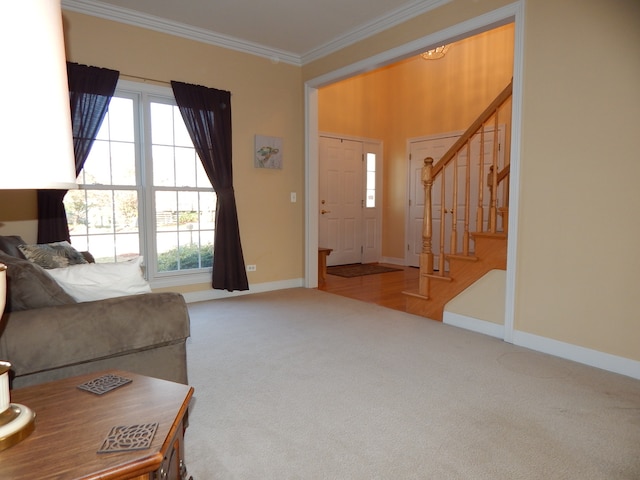 living room featuring plenty of natural light, light colored carpet, and ornamental molding