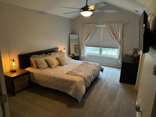 bedroom with ceiling fan, carpet, and lofted ceiling