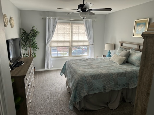 bedroom featuring ceiling fan and carpet