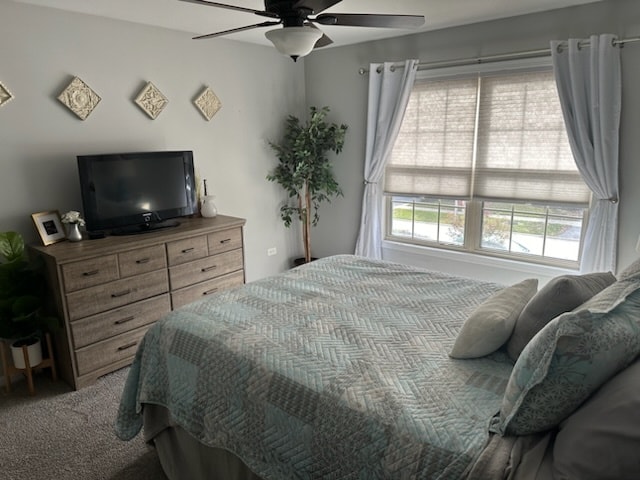 carpeted bedroom featuring ceiling fan