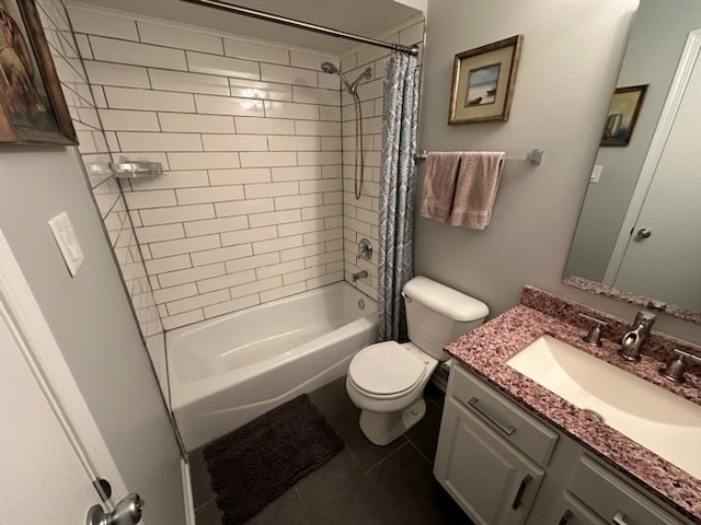 full bathroom featuring tile patterned flooring, vanity, shower / tub combo with curtain, and toilet