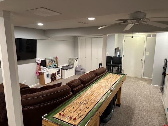 recreation room featuring ceiling fan and carpet floors