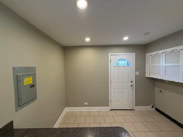 tiled foyer entrance with electric panel