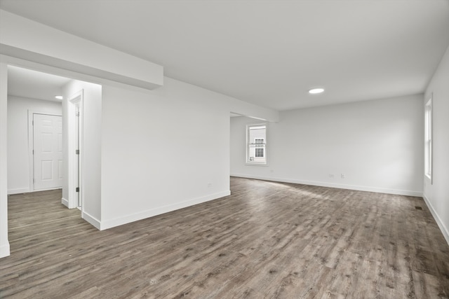 unfurnished room featuring dark hardwood / wood-style flooring