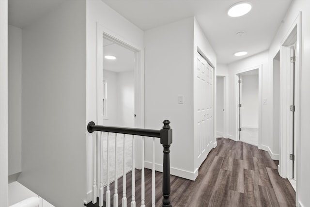 hallway with dark hardwood / wood-style floors