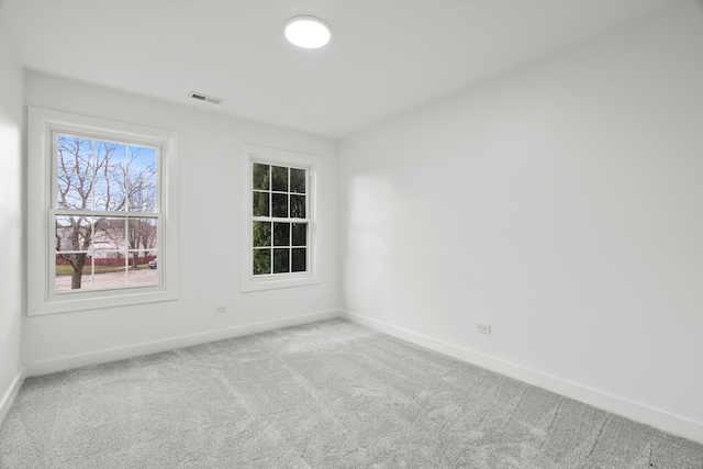 unfurnished room featuring carpet flooring