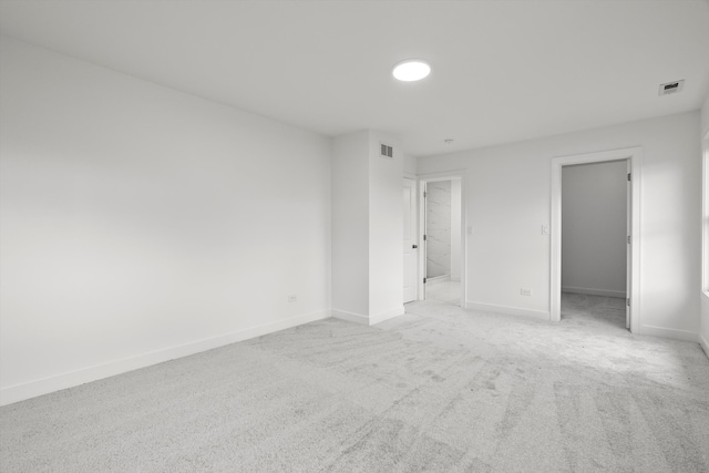 empty room with light colored carpet