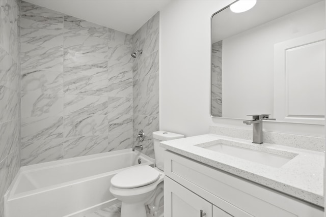 full bathroom with toilet, vanity, and tiled shower / bath