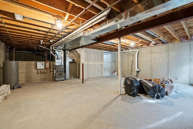 basement featuring heating unit and gas water heater