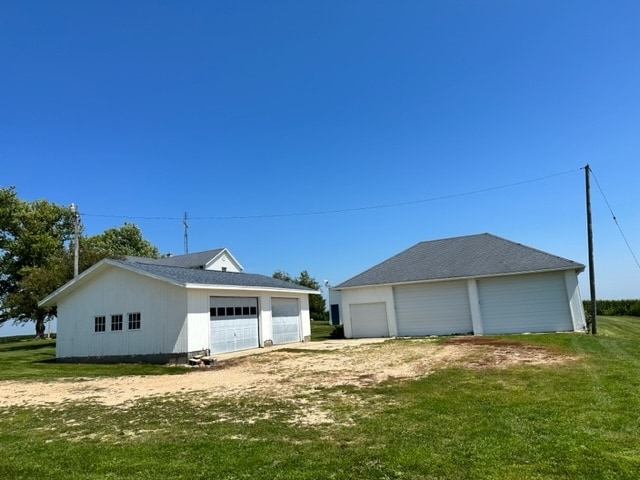 garage featuring a yard