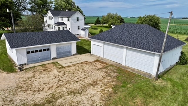 garage featuring a lawn