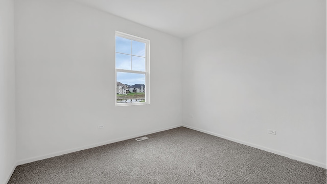 unfurnished room with carpet floors