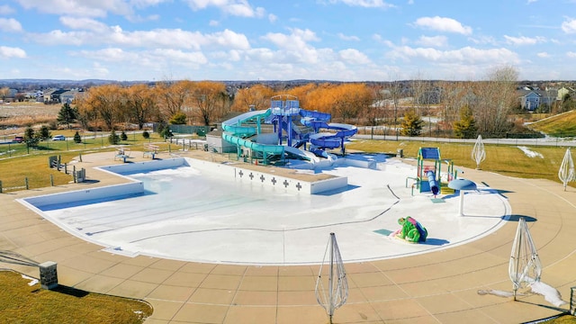 view of pool with a playground