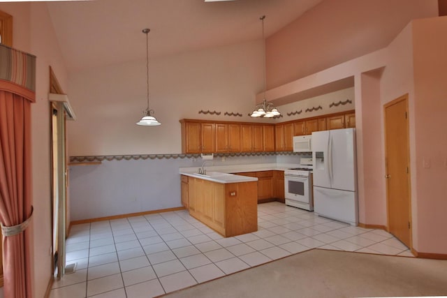 kitchen featuring kitchen peninsula, pendant lighting, white appliances, and high vaulted ceiling