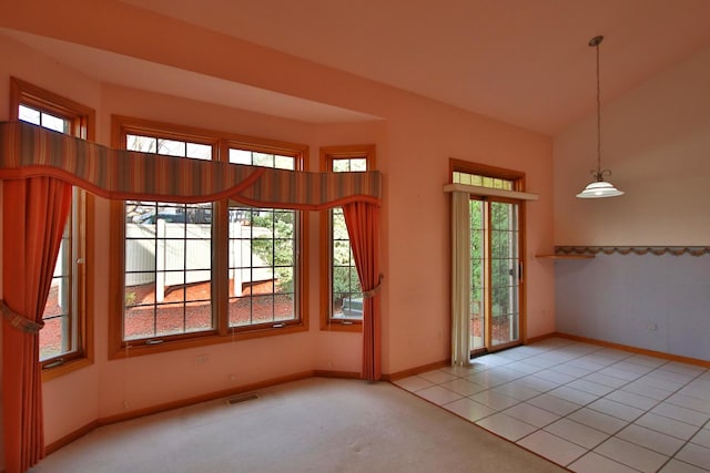 doorway with a healthy amount of sunlight and light colored carpet