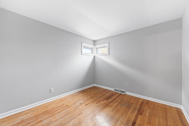 spare room featuring hardwood / wood-style floors