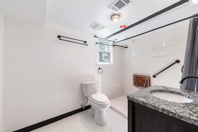 bathroom featuring vanity, toilet, and walk in shower