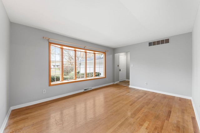 spare room featuring light wood-type flooring