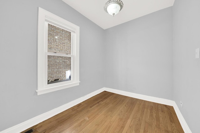 unfurnished room featuring wood-type flooring