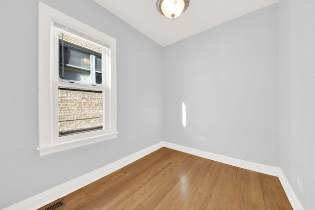 spare room featuring hardwood / wood-style flooring