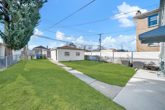 view of yard with central air condition unit and an outbuilding