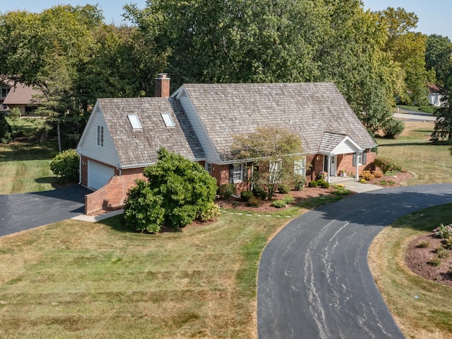 view of front of home featuring a garage and a front yard