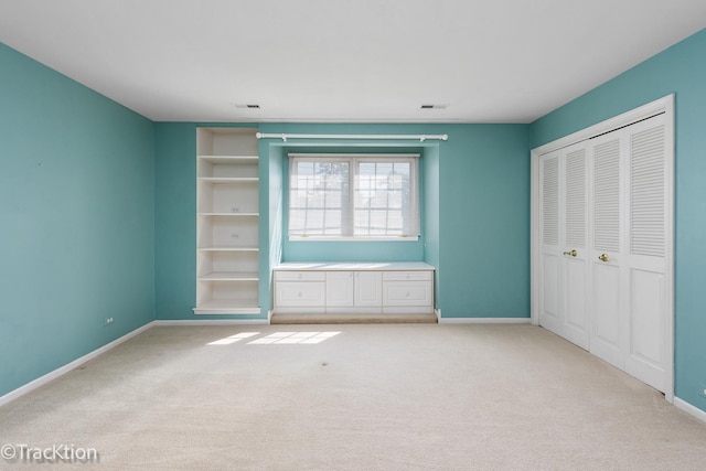 unfurnished bedroom with light carpet