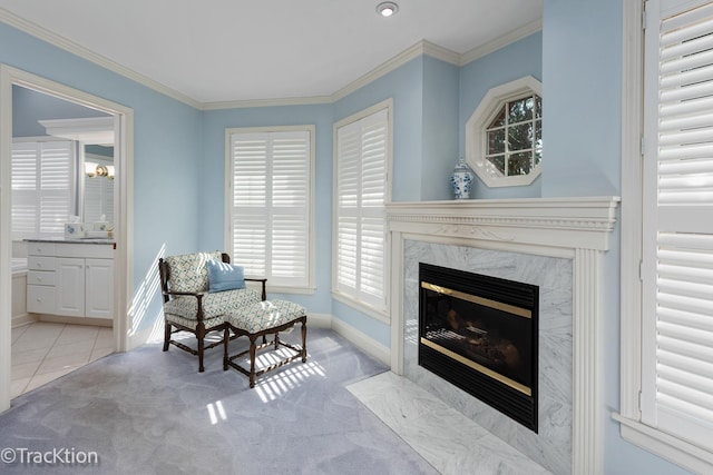 living area with light colored carpet, ornamental molding, and a fireplace