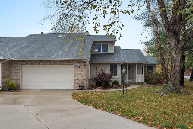 view of front of home featuring a garage and a front lawn