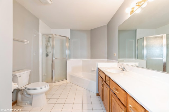 full bathroom featuring tile patterned flooring, shower with separate bathtub, vanity, and toilet