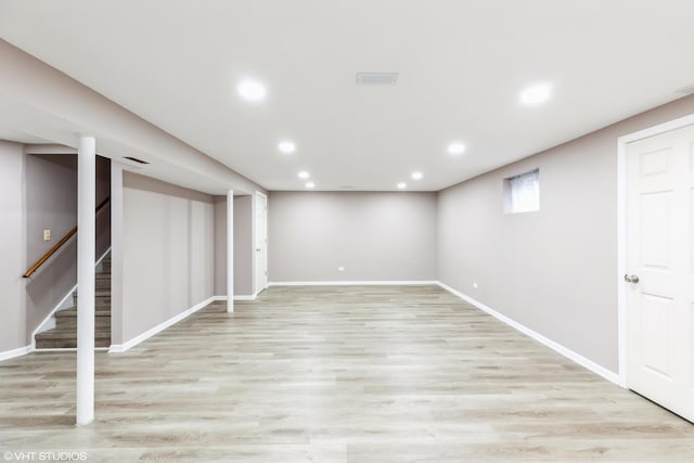 basement featuring light hardwood / wood-style floors