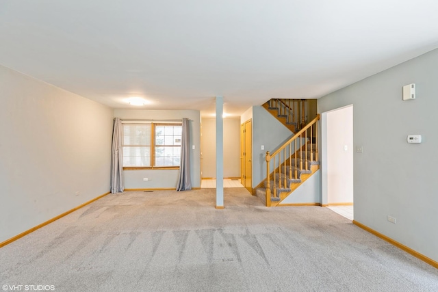 unfurnished room with light colored carpet