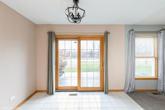 entryway featuring a chandelier and a healthy amount of sunlight