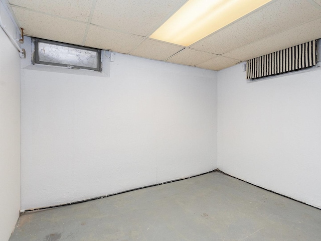 basement featuring a drop ceiling