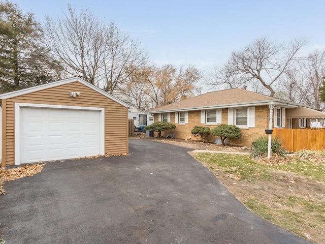 view of side of property with a garage and an outdoor structure