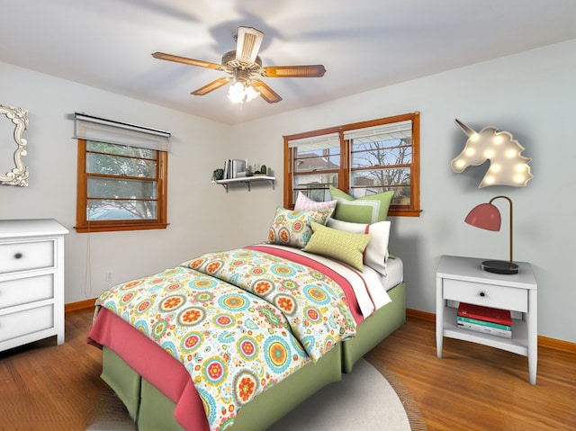 bedroom featuring dark hardwood / wood-style flooring and ceiling fan