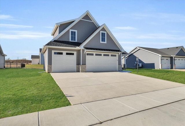 view of front of home with a front yard and a garage