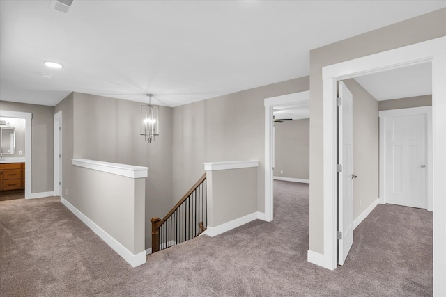 hallway featuring carpet flooring