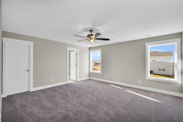 spare room featuring carpet flooring and ceiling fan