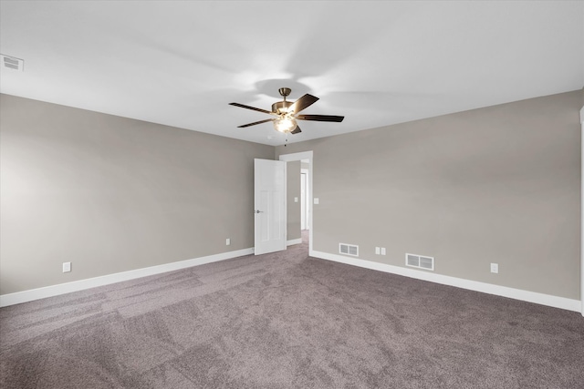 unfurnished room with ceiling fan and carpet